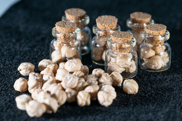 macro photography of raw chickpeas in glass jars