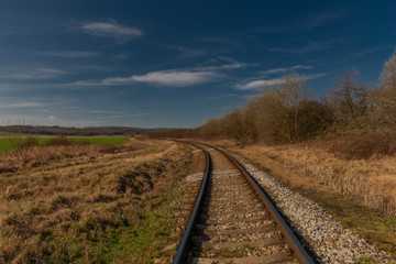 Fototapeta na wymiar Railway track near Kojetice na Morave station in winter sunny day