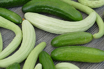 white cucumber and salt, pickle, lots of fresh garden cucumbers,