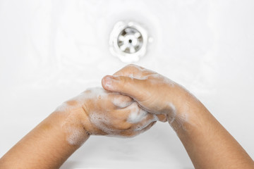 child washing hands