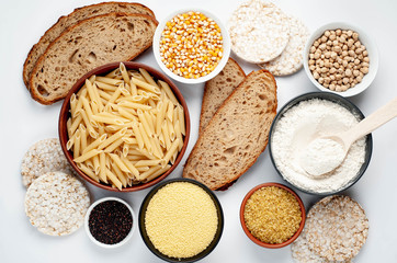 Selection of gluten free food. Chickpeas, bread, couscous, bulgur, pasta, bread, flour, quinoa on a white background, isolated