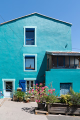 Fototapeta na wymiar Trentemoult village colorful house green blue in France Brittany Nantes