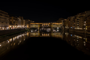 Nighttime view of Ponte Vecchio and River Arno, Tuscany, Italy