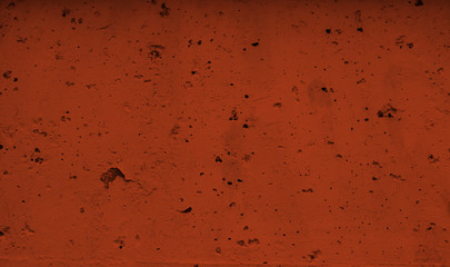 A brown surface with chips and slight bumps. Background of surface with chips and holes