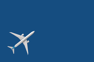 Model plane, airliner, airplane on blue background. travel and transportation concept