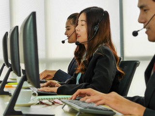 the young skill business asian Thai employee working as the customer service call center...