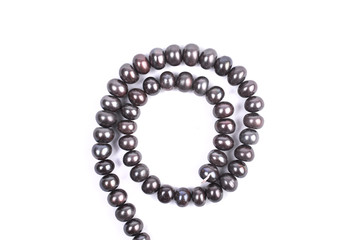 Brown pearl beads isolated on a white background