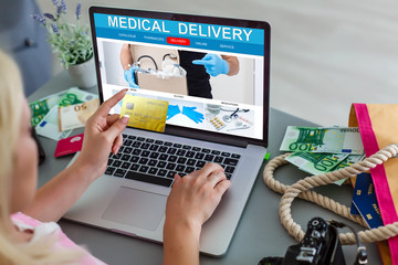 Online pharmacy. Application in your laptop for online ordering of medicines. laptop close-up. Lots of pills.