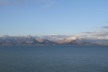 Fototapeta na wymiar Mountains and sea view in Antalya with snow covered mountains