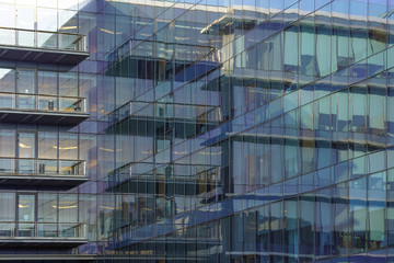Plakat Abstract modern building background for design. Glass architecture of a modern building. The texture of the windows of the building.