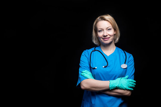 Female Adult Smiling Doctor Over Black Background