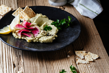 Green hummus with pickled watermelon radishes