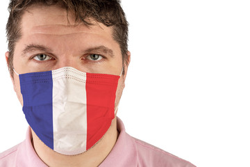 Portrait of adult caucasian man who wears protective mask on his face against influenza and protect health from bacteria. Flag of France.