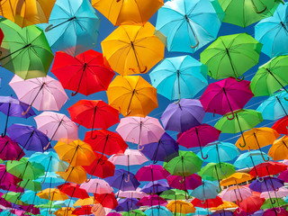 Fototapeta na wymiar Beautiful colorful umbrellas against a deep blue sky.