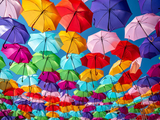 Fototapeta na wymiar Beautiful colorful umbrellas against a deep blue sky.