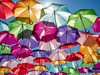 Fototapeta na wymiar Beautiful colorful umbrellas against a deep blue sky.