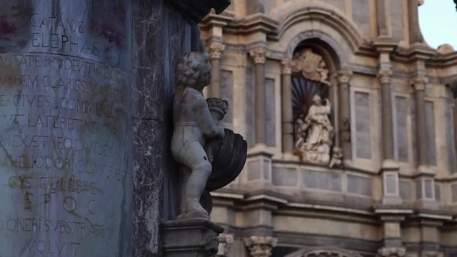 Sculpture on elephant fountain in Cathedral Sant Agata on Piazza del Duomo in Catania, Sicily, Italy. Summer tourism landmark & family travel destination in Europe.