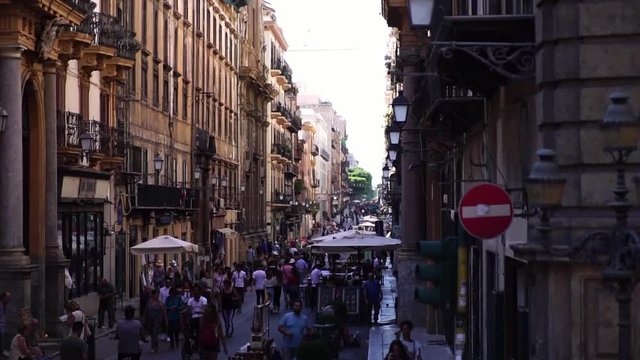 Drone low angle shot. Busy street in Palermo. Picturesque historic town in Sicily Italy. Summer tourism landmark & family travel destination in Europe. 