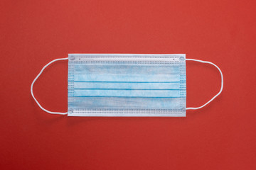 Medical mask on red background, Corona protection