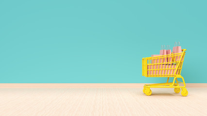 Shopping cart with bags on mint green wall background.