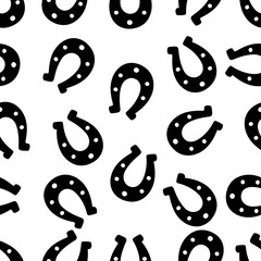 Silhouette of a happy horseshoe. Seamless vector pattern. Endless ornament. Isolated colorless background. Horse shoes. Imitation of ink drawing. Flat style. Idea for web design, covers, textiles.