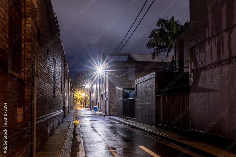 Wall mural wet street at night