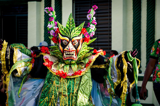 Closeup Man In Extraordinary Bright Costume Poses For Photo On Dominican Carnival