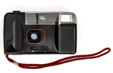 Old film camera isolated on white background