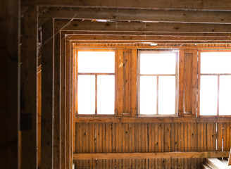the attic of a wooden house. sun light through window