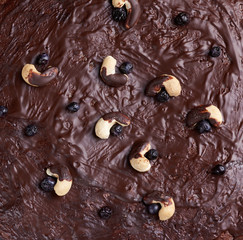 texture of baked brownie chocolate cake with chocolate poured. Cooked homemade food