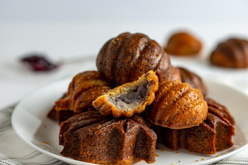 Baked mini butter mochi cake in maple leaf and pumpkin shape, crisp on the outside and chewy on the inside