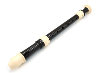 Black flute recorder on a white isolated background, top view