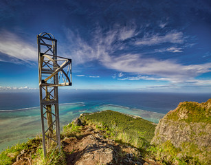 The steal cross at Mauritius famous mountain Le Morne Brabant mountain.