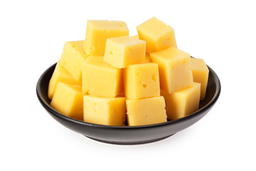 Cut of cheese in a black plate isolated on a white background