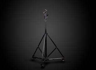 Photo studio lighting stands isolated on the black background.