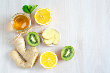 Vitamin C foods to boost immunity during the epidemic and colds. flat lay, top view on honey,...