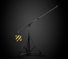 Photo studio lighting stands isolated on the black background.