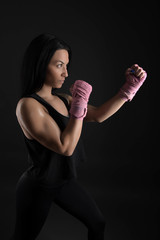 sexy girl training in the gym engaged in boxing