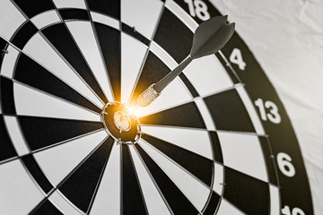 Background with symbol concept of business success achievement focus with red dart game aim and hit center target spot on dartboard for professional winning
