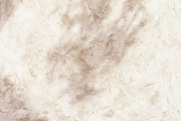 Light wall background with stucco on concrete with shadow, texture