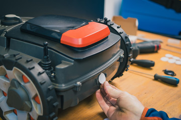 Changing the filter or neoprene breather inset for the robotic lawnmower. Changing watertight...