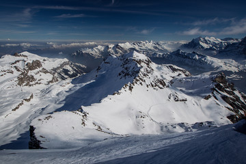 Beautiful alpine panorama on a sunny day from the top of Schilthorn, Switzerland, peak above Murren. Gorgeous landscape in switzerland
