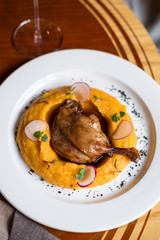 Duck Leg Confit with Pumpkin Puree and Red Wine Sauce