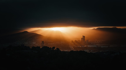 Scenic view of city against dramatic sunset