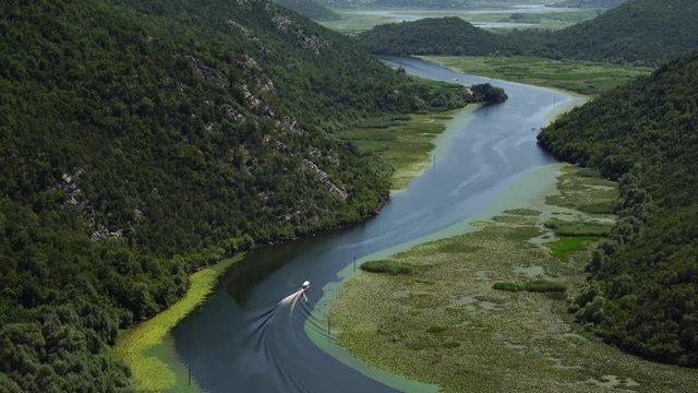 Canyon of Rijeka Crnojevica river near the Skadar lake coast. One of the most famous views of Montenegro. Summer tourism & family travel destination in Balkans Europe.
