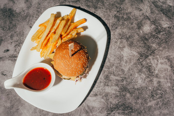 a hamburger with french fries