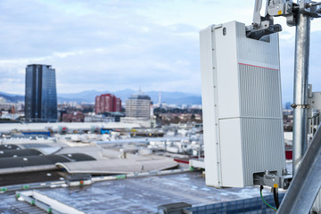 5G new radio telecommunication network antenna mounted on a metal pole providing strong signal...