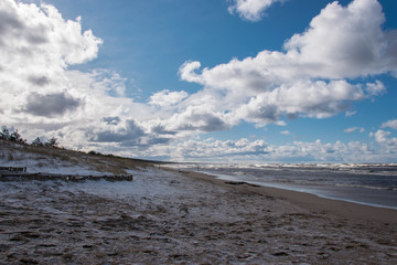 Deserted beach of the Baltic Sea on a windy March day.