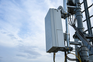 5G new radio telecommunication network antenna mounted on a metal pole providing strong signal...
