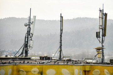 Cellular radio telecommunication network antenna mounted on a metal pole providing strong signal...